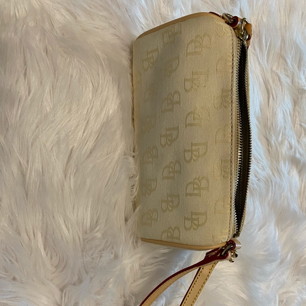 Dooney and Bourke cream small purse/wristlet
